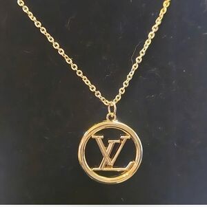 Gold Tone Round Iconic Logo Pendant Necklace